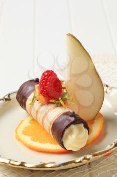 Chocolate dipped wafer tube filled with cream