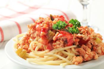 Minced meat sauce served on a bed of cooked spaghetti