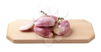 Bulbs of Spanish onion on a chopping board