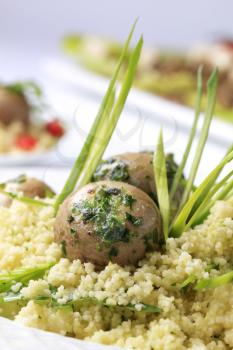 Vegetarian meal - Couscous with button mushrooms, pesto and spring onion