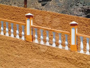 Outdoor balustrade railing painted white and orange