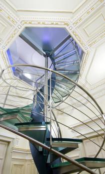 Modern spiral staircase, contrast of architectural styles