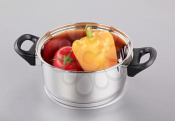 Fresh tomato and pepper in a pan