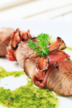 Pork and bacon shish kebab with herb sauce