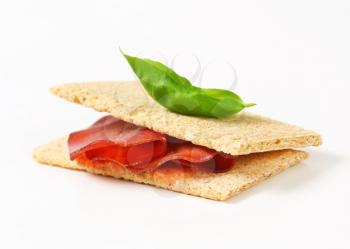 Whole grain crisp bread with thin sliced smoked beef