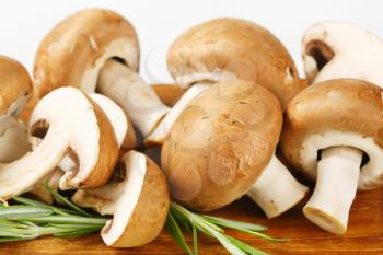 Fresh cremini mushrooms on cutting board