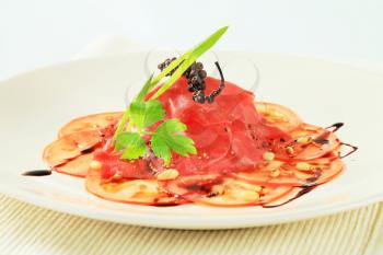 Tomato and beef Carpaccio with  balsamic vinegar