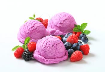 Scoops of ice cream with fresh berries
