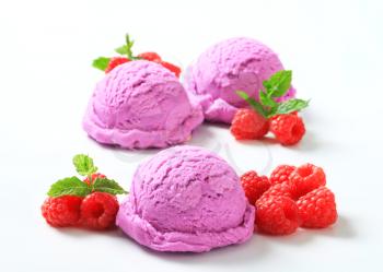Scoops of purple ice cream and fresh raspberries