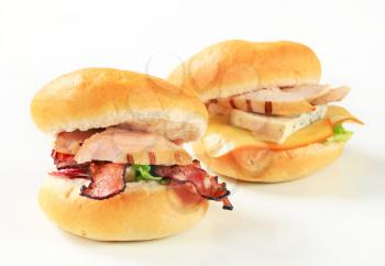 Grilled chicken sandwiches with bacon strips and cheese