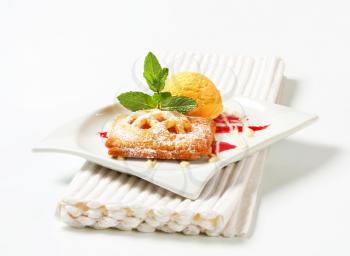Little apricot pie with ice cream and drizzle sauce