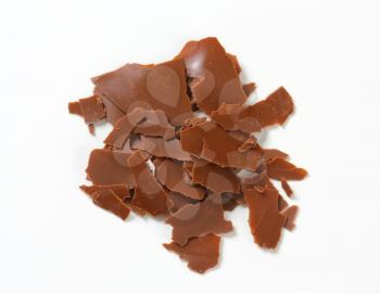 Chocolate shavings on white background