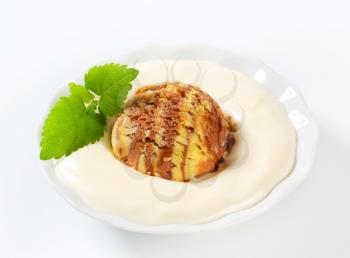 Vanilla pudding and scoop of ice cream