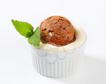 Pudding and scoop of ice cream in ramekin