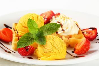 Belgian waffle with fresh strawberries and ice cream