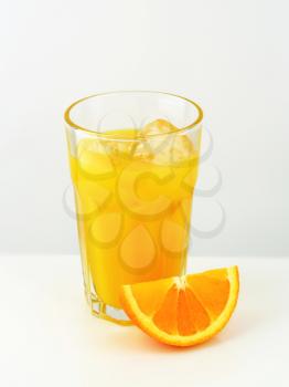 Glass of orange juice with ice