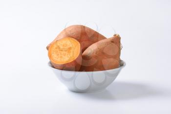 Sweet potatoes with orange flesh (rich source of vitamin A)