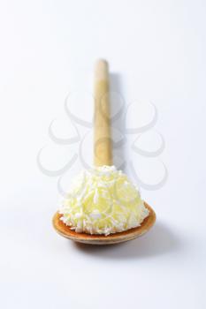 White Chocolate Coconut Truffles on wooden spoon