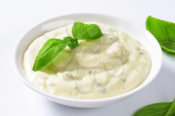 Creamy salad dressing made of mayonnaise, buttermilk, garlic, herbs, spices and grated cheese