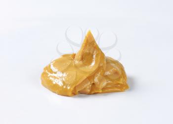 Creamy peanut butter on white background
