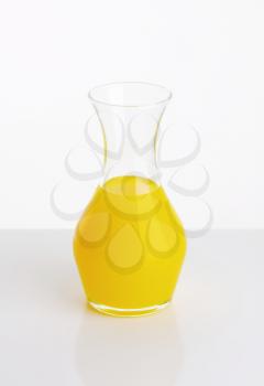 Yellow fresh fruit juice in a carafe
