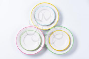 Set of rimmed plates with pastel colored edges