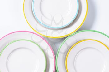 Set of rimmed plates with pastel colored edges