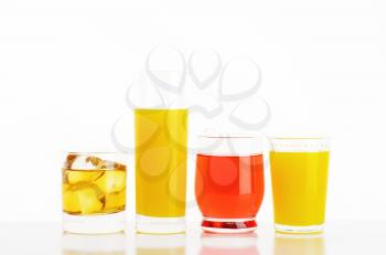 fresh fruit juices and iced drinks on white background