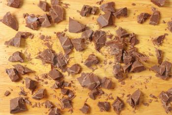 pieces of chocolate on wooden cutting board