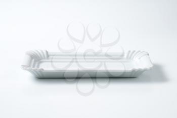 white rectangular plate with decorative rim