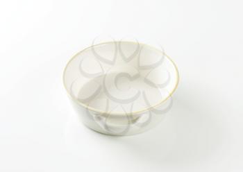 Round white ceramic dish with side handles