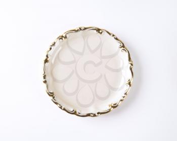 white plate with gold decorative edge