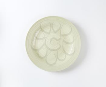 Beige dinner plate with white concentric rings