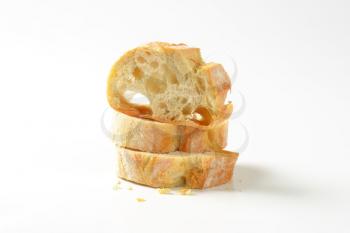 Ciabatta bread slices on white background