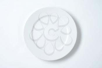 empty white dinner plate with rim