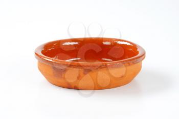 empty red clay bowl glazed on the inside
