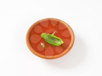 tomato soup in terracotta bowl