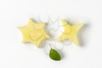 two star-shaped pieces cut out of an apple