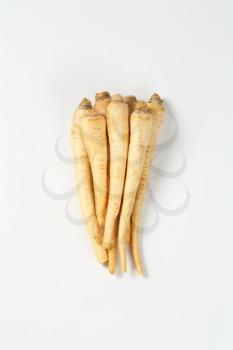 bunch of fresh parsley roots on white background