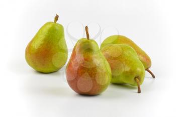 four ripe pears on white background