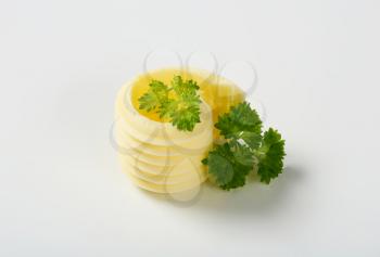butter curl with parsley on white background