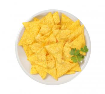 triangle shaped tortilla chips on plate