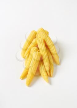 heap of sweet baby corn on white background