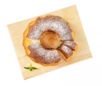 marble bundt cake on cutting board, two slices cut off