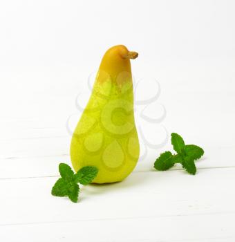fresh yellow pear on white wooden background