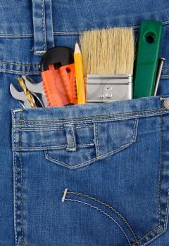 tools and instruments in blue jeans pocket