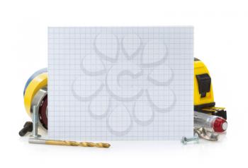 notebook and tools isolated on white background