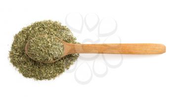 dried green spices and spoon isolated on white background