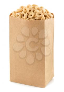 cereal corn rings in paper bag isolated on white background