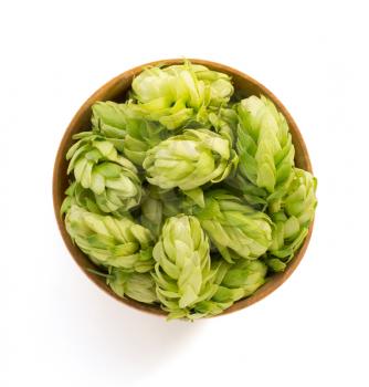bowl full of hop cones isolated on white